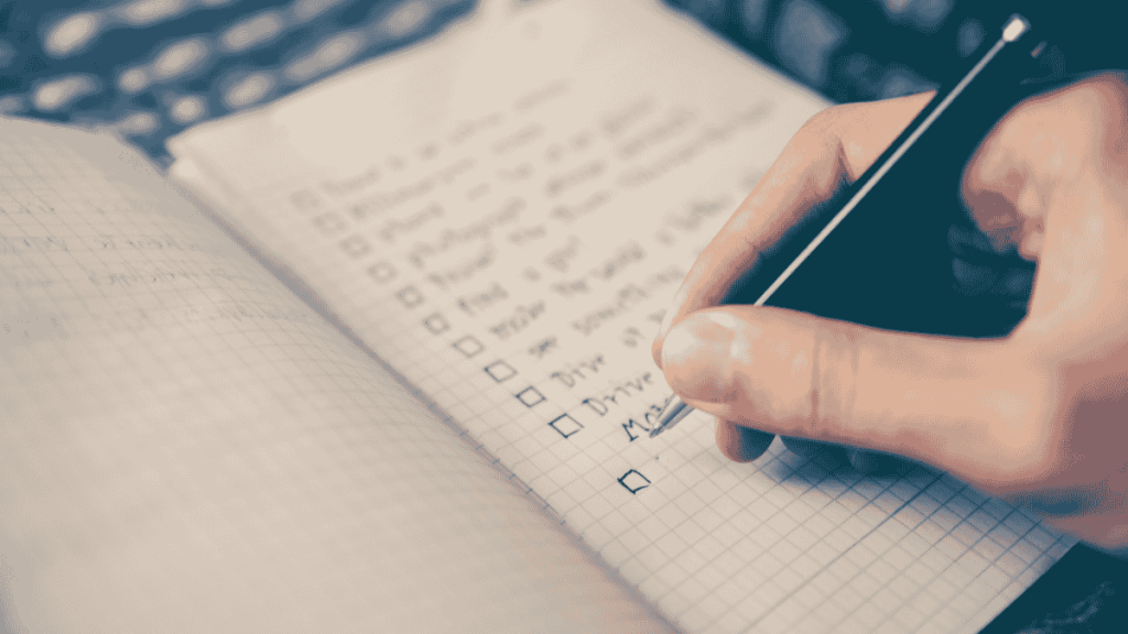 image of a hand scribbling on a page of a notebook. It demonstrates the power of a writing routine.